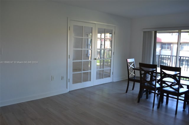 dining space featuring dark hardwood / wood-style floors and french doors