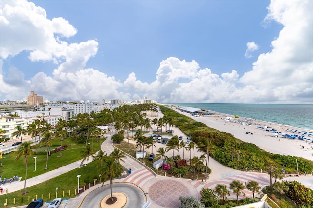 bird's eye view featuring a water view and a view of the beach