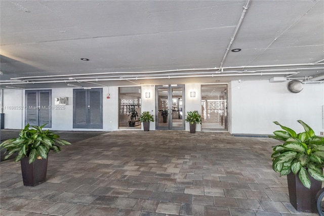 interior space with a patio and french doors