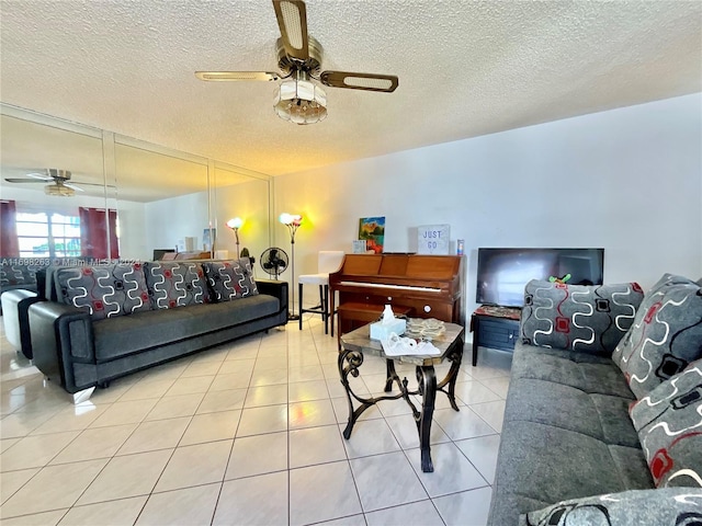 tiled living room featuring a textured ceiling