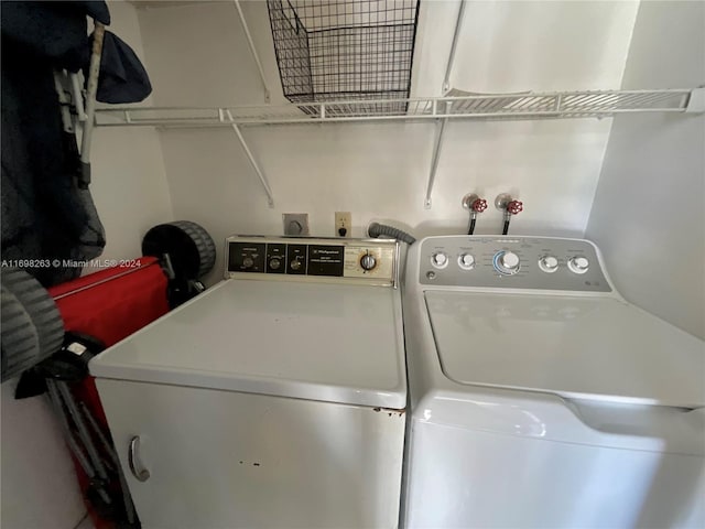 clothes washing area with independent washer and dryer