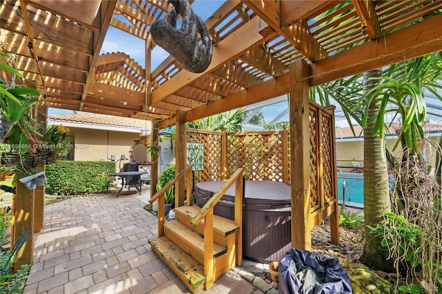 view of patio / terrace with a pergola and a hot tub