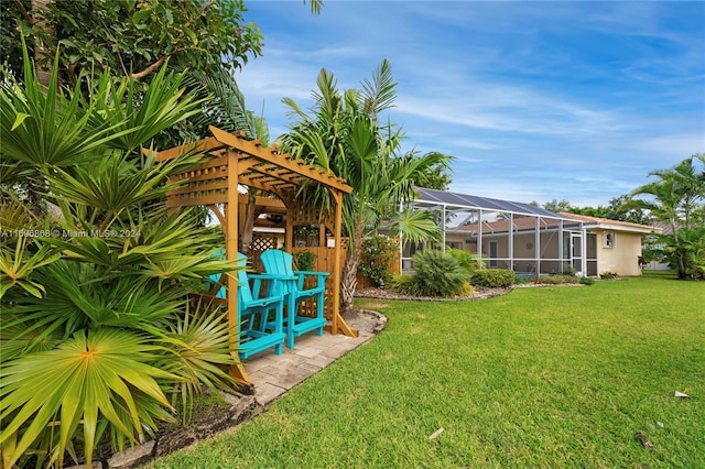 view of yard with a lanai and a pergola