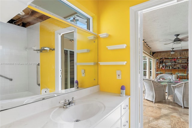 bathroom featuring vanity and ceiling fan