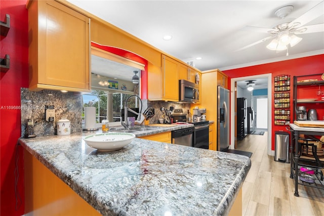 kitchen featuring decorative backsplash, light wood-type flooring, ornamental molding, appliances with stainless steel finishes, and light stone counters