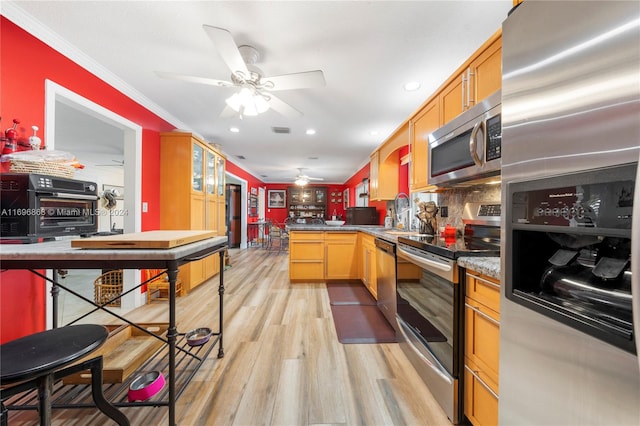 kitchen with decorative backsplash, ornamental molding, stainless steel appliances, stone counters, and light hardwood / wood-style floors