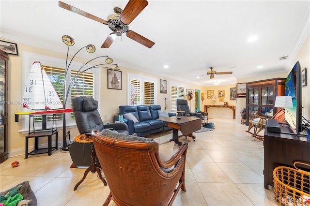 living room with crown molding, light tile patterned floors, and ceiling fan