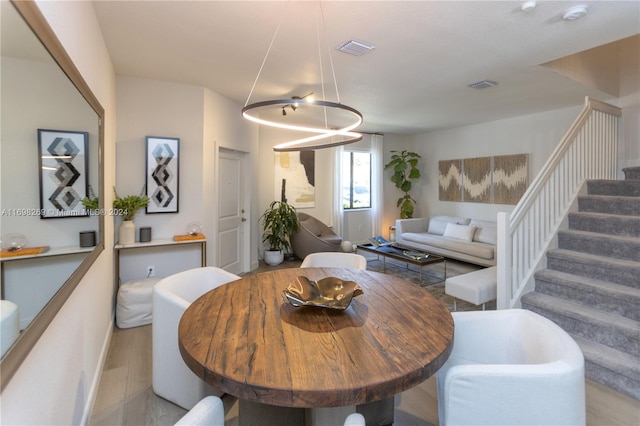 dining space featuring light hardwood / wood-style floors