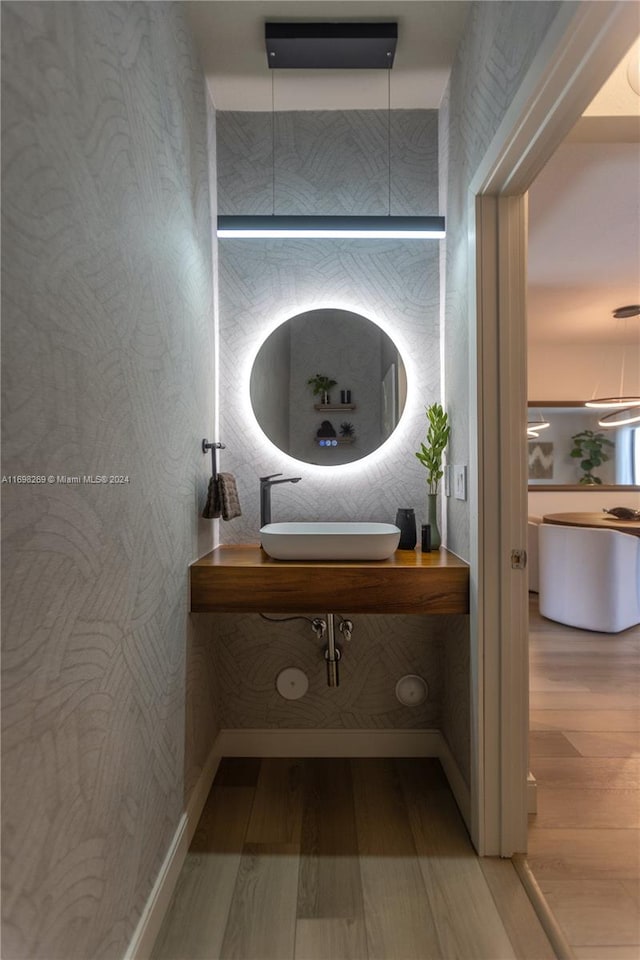 bathroom with vanity and hardwood / wood-style flooring