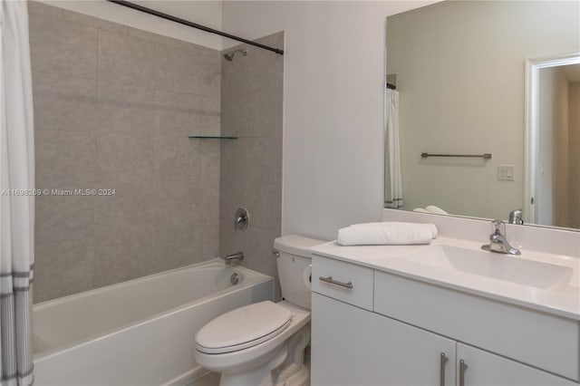 full bathroom with shower / bath combination with curtain, vanity, and toilet