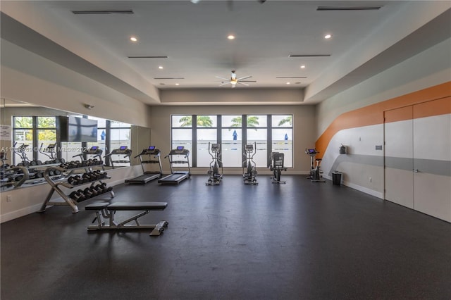 gym with ceiling fan and a healthy amount of sunlight