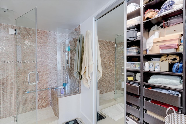 bathroom featuring tile patterned floors and walk in shower