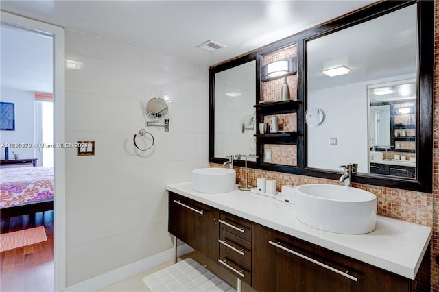 bathroom featuring hardwood / wood-style floors and vanity