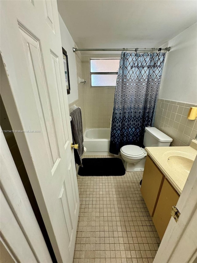 7060 Nova Dr Unit 306C, Davie, FL 33317 - full bath with shower / tub combo, tile patterned flooring, vanity, tile walls, and wainscoting