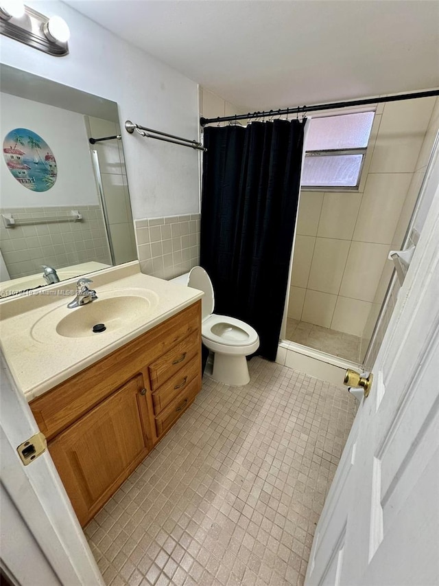 7060 Nova Dr Unit 306C, Davie, FL 33317 - full bathroom with vanity, a shower stall, tile walls, and tile patterned flooring
