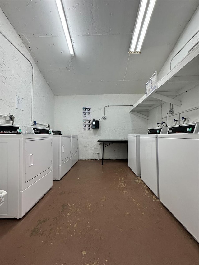 7060 Nova Dr Unit 306C, Davie, FL 33317 - shared laundry room featuring independent washer and dryer and a textured wall
