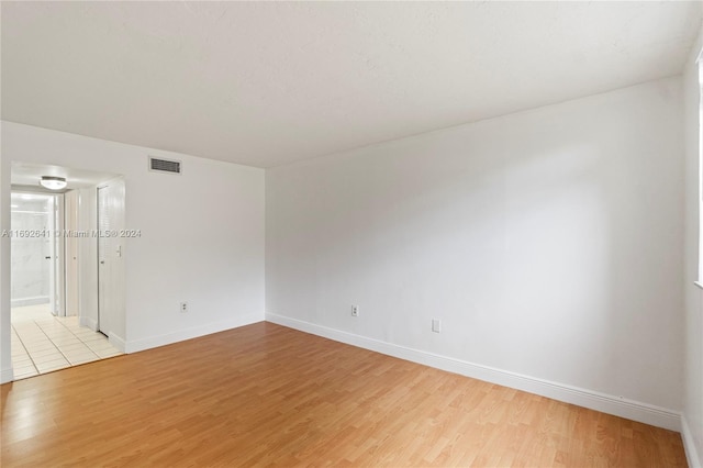 empty room with light hardwood / wood-style floors