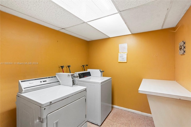 laundry room with washing machine and clothes dryer