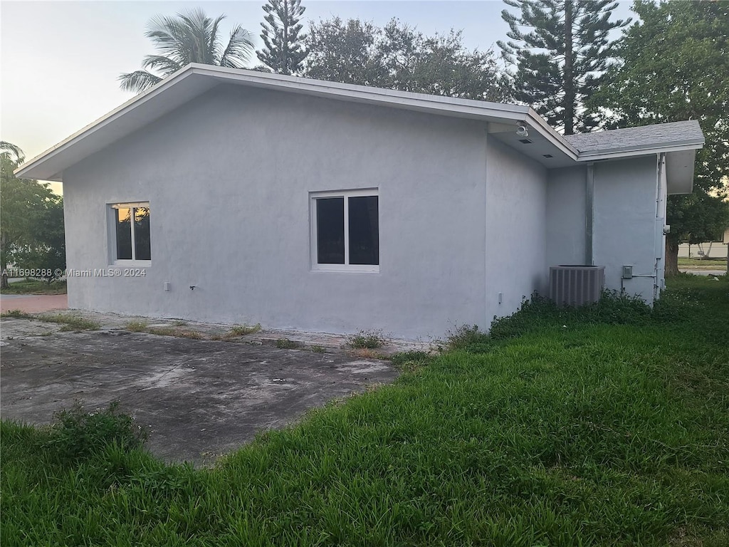 view of property exterior with central air condition unit