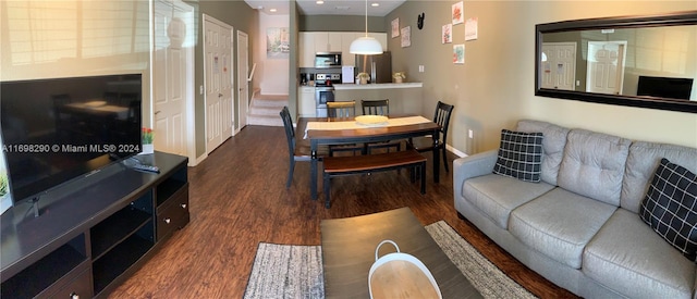 living room featuring dark hardwood / wood-style flooring