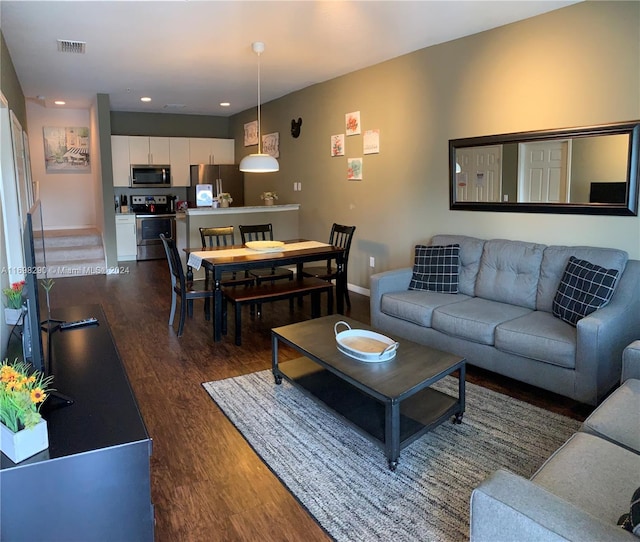 living room featuring dark hardwood / wood-style floors