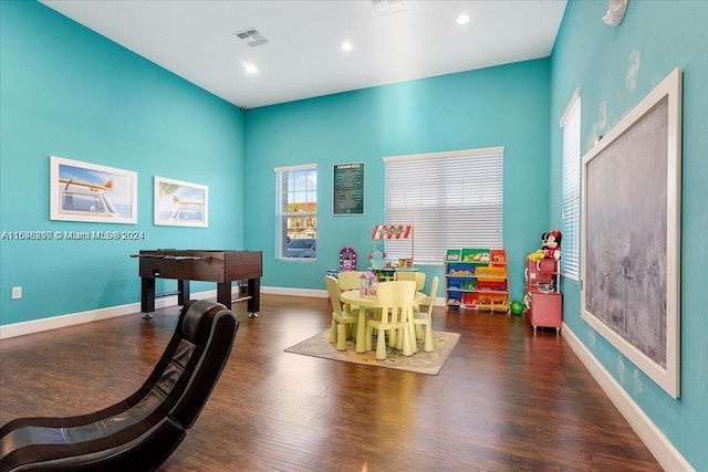 playroom with dark hardwood / wood-style floors