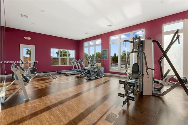 workout area with hardwood / wood-style flooring