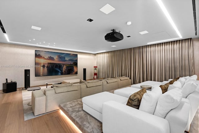 home theater room with light wood-type flooring