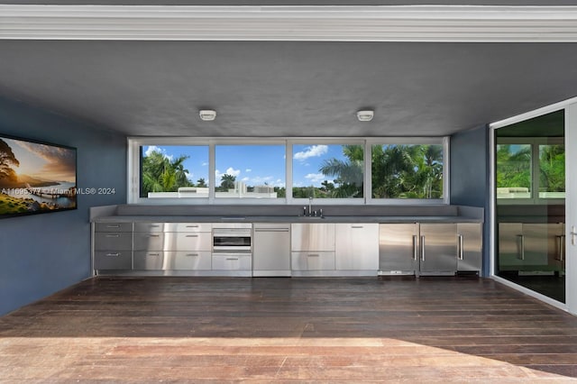 kitchen featuring dishwasher, sink, dark wood-type flooring, and high end fridge