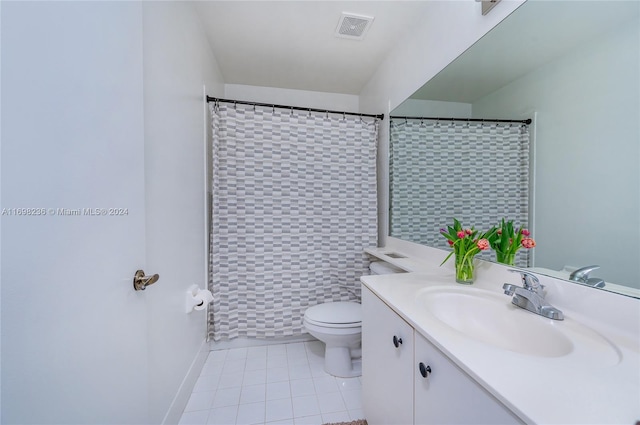 bathroom featuring vanity, tile patterned flooring, toilet, walk in shower, and tile walls