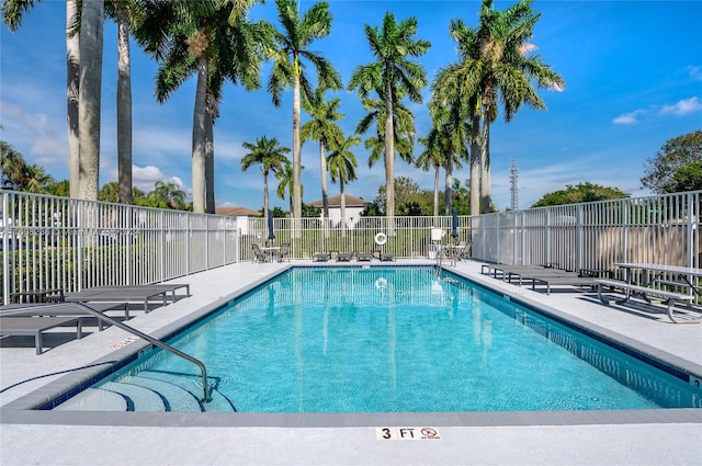 view of swimming pool with a patio area