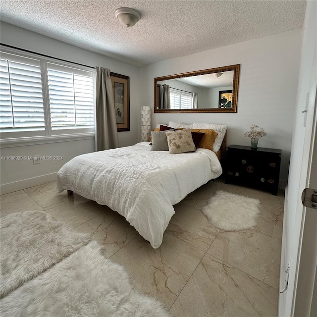 bedroom with a textured ceiling