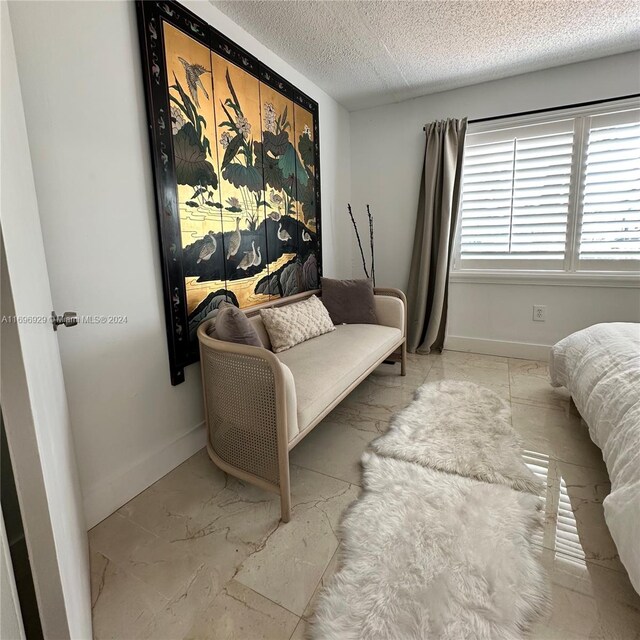 bedroom featuring a textured ceiling