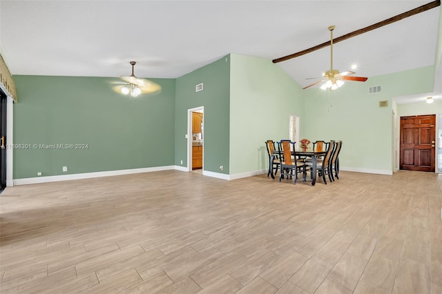 dining room with beamed ceiling, ceiling fan, light wood-type flooring, and high vaulted ceiling