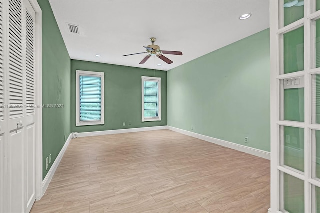 interior space with ceiling fan and light hardwood / wood-style flooring