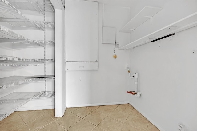 laundry room featuring light tile patterned flooring