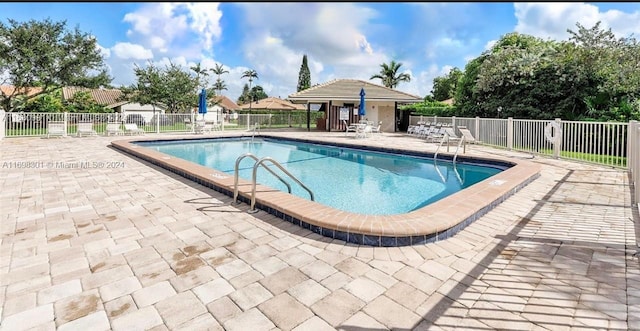 view of pool featuring a patio