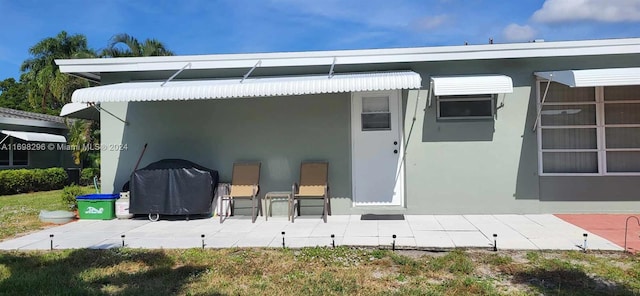 back of property featuring a patio