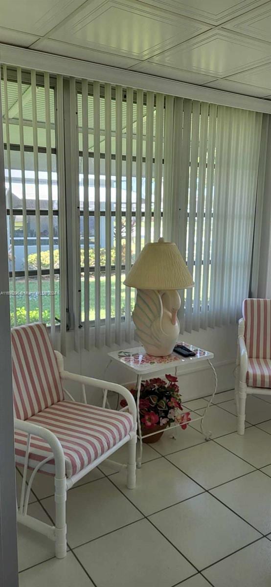 unfurnished sunroom featuring a water view and a wealth of natural light