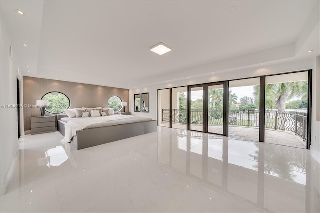 bedroom with access to outside, multiple windows, and french doors