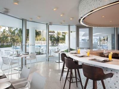 16901 Collins Ave Unit 1402, Sunny Isles Beach, FL 33160 - dining room with a wall of windows and plenty of natural light