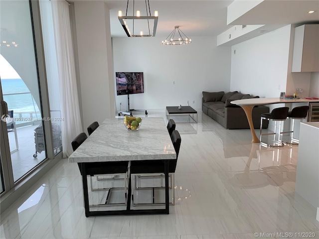 dining space with a notable chandelier and wine cooler