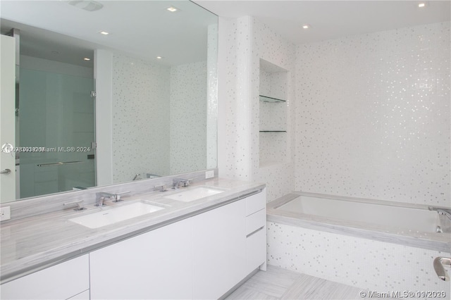16901 Collins Ave Unit 1402, Sunny Isles Beach, FL 33160 - full bathroom with double vanity, a bathtub, recessed lighting, and tile patterned flooring