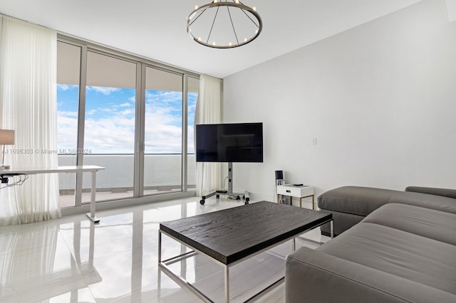 living room featuring floor to ceiling windows, light tile patterned flooring, and a chandelier