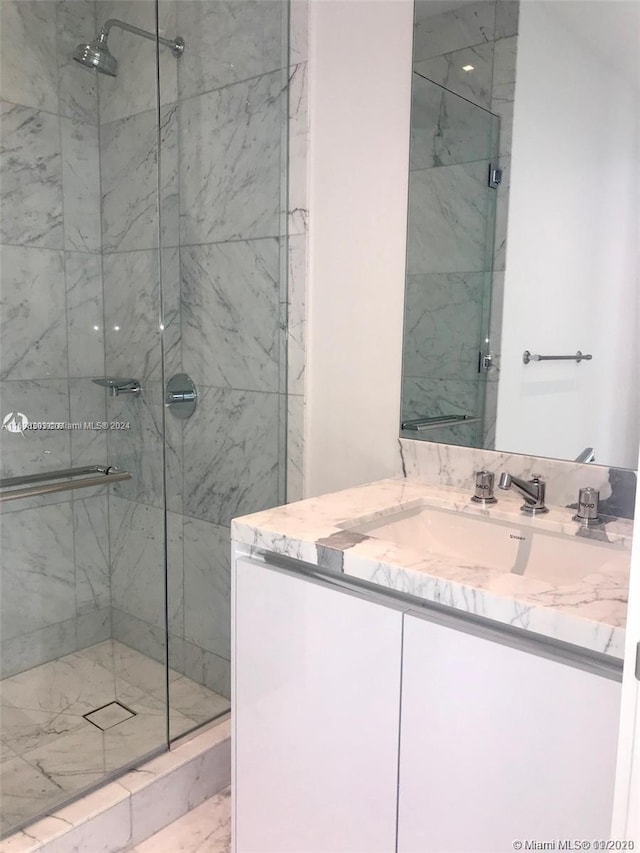 16901 Collins Ave Unit 1402, Sunny Isles Beach, FL 33160 - bathroom with a marble finish shower and vanity