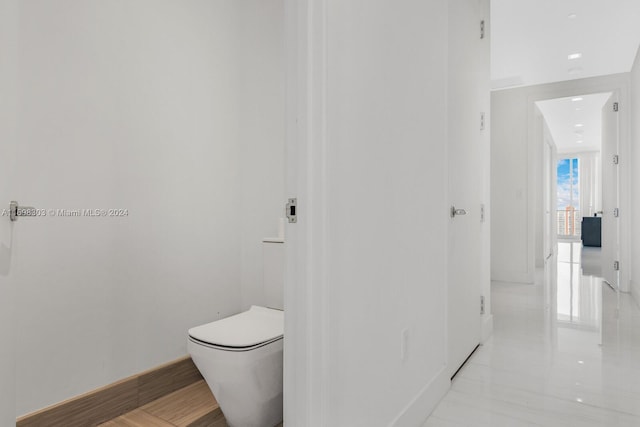 16901 Collins Ave Unit 1402, Sunny Isles Beach, FL 33160 - bathroom featuring toilet and baseboards