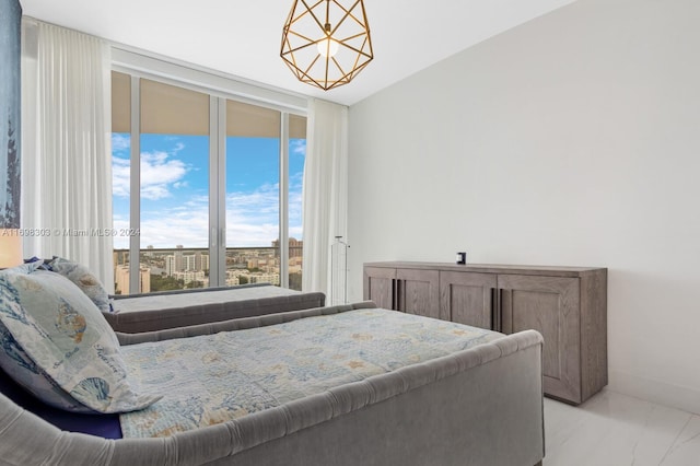 16901 Collins Ave Unit 1402, Sunny Isles Beach, FL 33160 - bedroom featuring floor to ceiling windows, light marble finish flooring, access to exterior, and baseboards