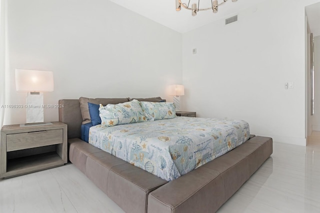 bedroom featuring a chandelier