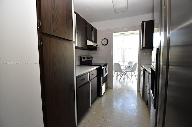 kitchen featuring appliances with stainless steel finishes, backsplash, and ceiling fan