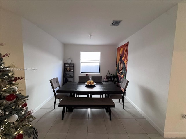 dining space with tile patterned flooring